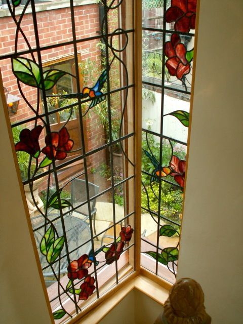 Bird and floral stained glass window by Mark Kearins